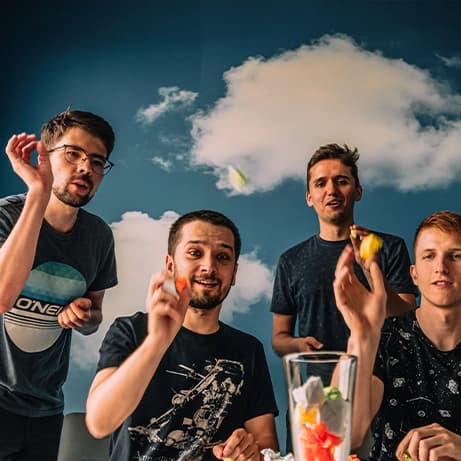 people happily throwing a paper notes with ideas into a glass